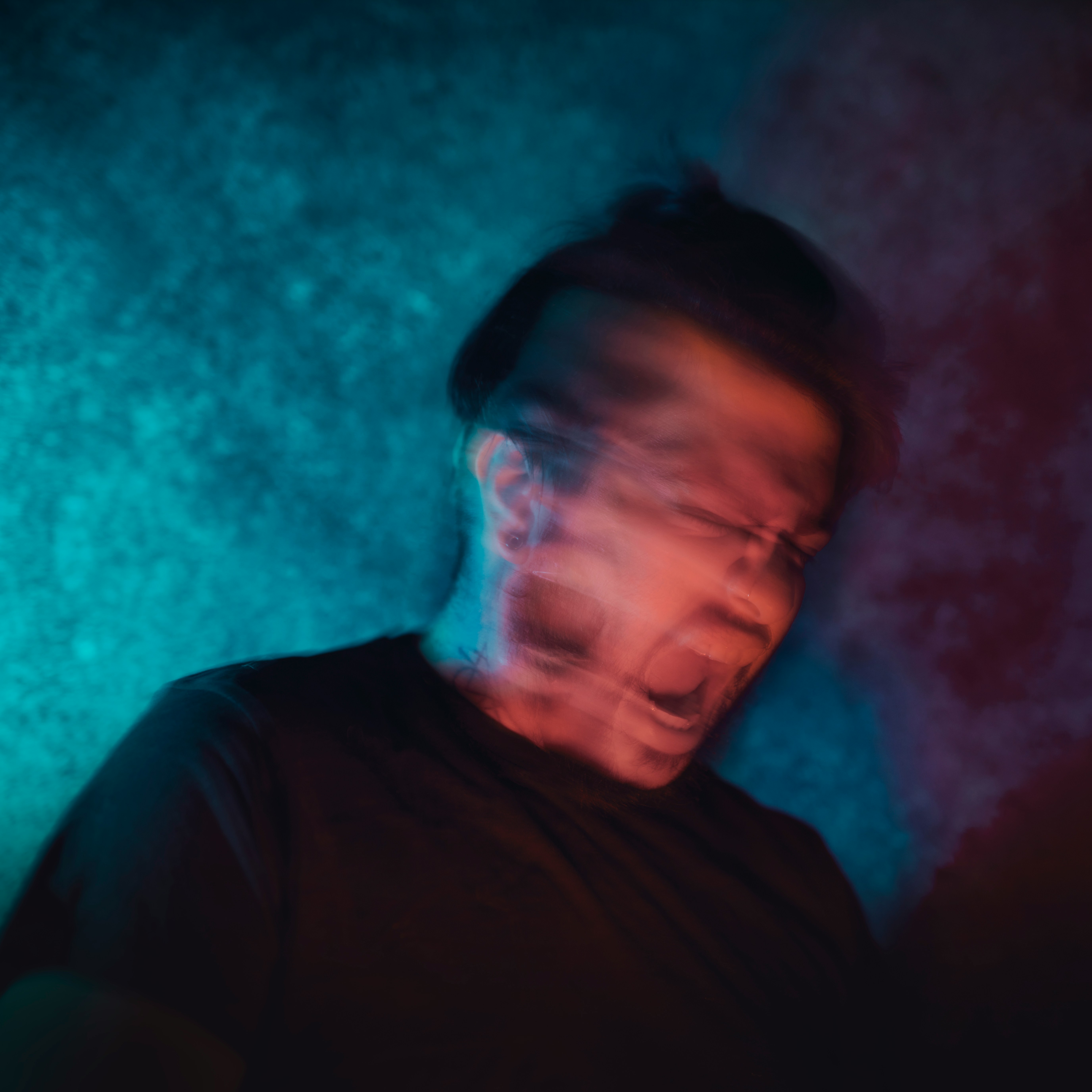 confused man in a dark room